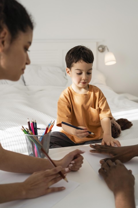 cute-little-boy-drawing-his-father-hand (Small)