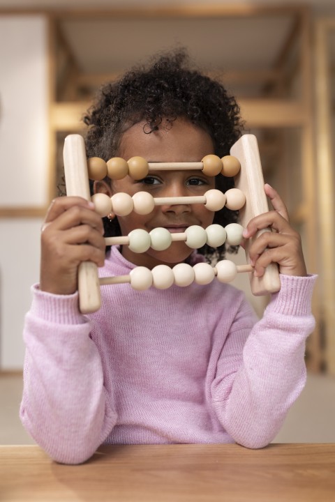 girl-playing-with-ecological-toys-front-view (Small)